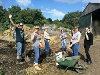 Volunteers from Emersons Green Primary School create a compost heap