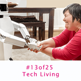 A lady with a learning disability shakes hands with a robot