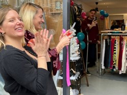 Jenny and Lotte cut the ribbon at the opening of the new shop