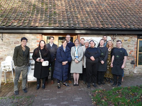 A group of people from Brandon, National Care Forum and Department of Health and Social Care outside Grimsbury Farm Barn Cafe