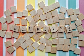 Scrabble tiles spelling the word: Equality